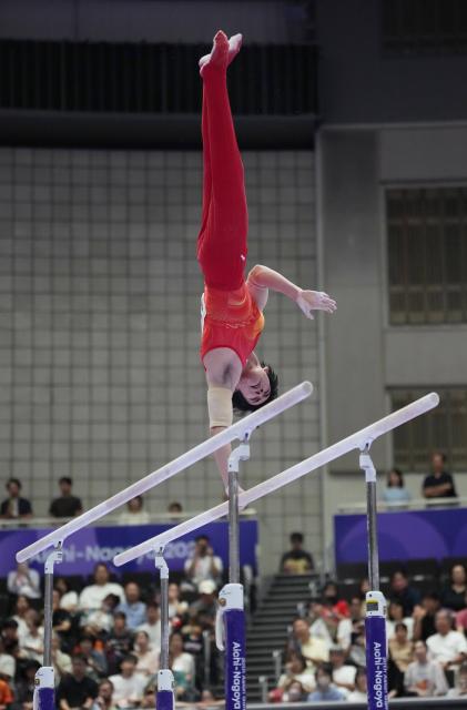 (260921) -- NAGOYA, Sept. 21, 2026 (Xinhua) -- Zhang Boheng of China competes on the parallel bars of the men's all-around final of Artistic Gymnastics at the 20th Asian Games Aichi-Nagoya 2026 in Nagoya, Japan, Sept. 21, 2026. (Xinhua/Jia Yuchen)