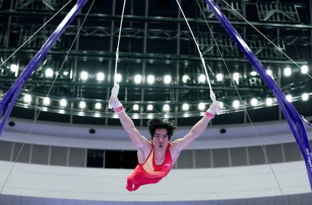 (260921) -- NAGOYA, Sept. 21, 2026 (Xinhua) -- Zhang Boheng of China competes in the rings of the men's all-around final of Artistic Gymnastics at the 20th Asian Games Aichi-Nagoya 2026 in Nagoya, Japan, Sept. 21, 2026. (Xinhua/Lui Siu Wai)