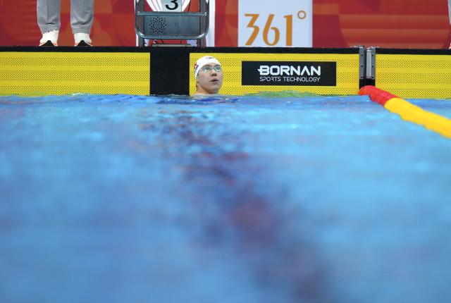 (260921) -- TOKYO, Sept. 21, 2026 (Xinhua) -- Qin Haiyang of China reacts after the men's 100m breaststroke final at the 20th Asian Games Aichi-Nagoya 2026 in Tokyo, Japan, Sept. 21, 2026. (Xinhua/Chen Zeguo)