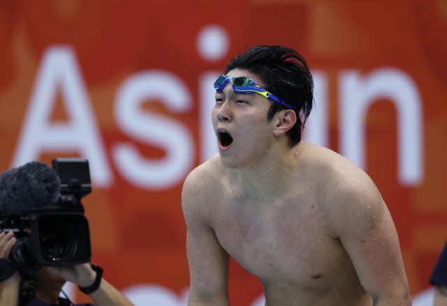 (260921) -- TOKYO, Sept. 21, 2026 (Xinhua) -- Dong Zhihao of China reacts after the men's 100m breaststroke final at the 20th Asian Games Aichi-Nagoya 2026 in Tokyo, Japan, Sept. 21, 2026. (Xinhua/Wu Zhizun)