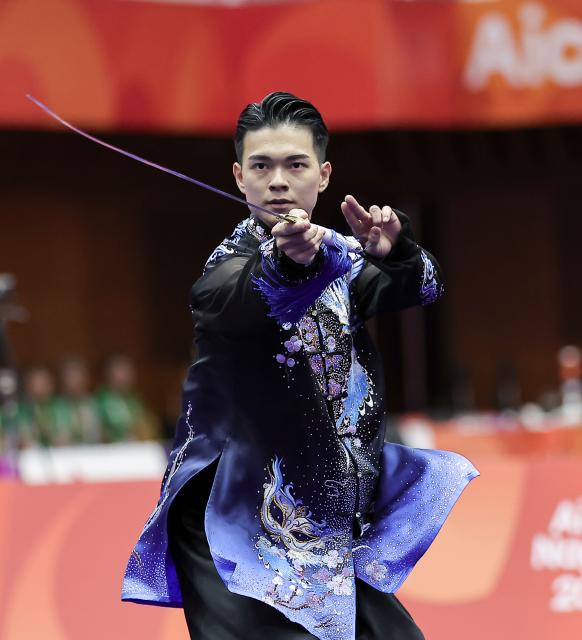 (260921) -- NAGOYA, Sept. 21, 2026 (Xinhua) -- Sun Chia-hung of Chinese Taipei performs during the Taijijian round of the men's Taijiquan and Taijijian final of Wushu at the 20th Asian Games Aichi-Nagoya 2026 in Nagoya of Aichi Prefecture, Japan, Sept. 21, 2026. (Xinhua/Long Lei)