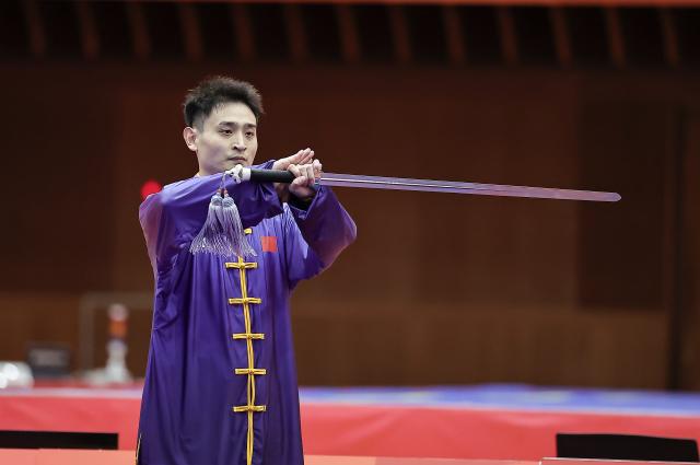 (260921) -- NAGOYA, Sept. 21, 2026 (Xinhua) -- Liu Dewen of China performs during the Taijijian round of the men's Taijiquan and Taijijian final of Wushu at the 20th Asian Games Aichi-Nagoya 2026 in Nagoya of Aichi Prefecture, Japan, Sept. 21, 2026. (Xinhua/Long Lei)