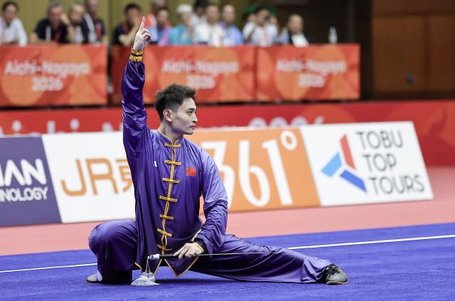 (260921) -- NAGOYA, Sept. 21, 2026 (Xinhua) -- Liu Dewen of China performs during the Taijijian round of the men's Taijiquan and Taijijian final of Wushu at the 20th Asian Games Aichi-Nagoya 2026 in Nagoya of Aichi Prefecture, Japan, Sept. 21, 2026. (Xinhua/Long Lei)
