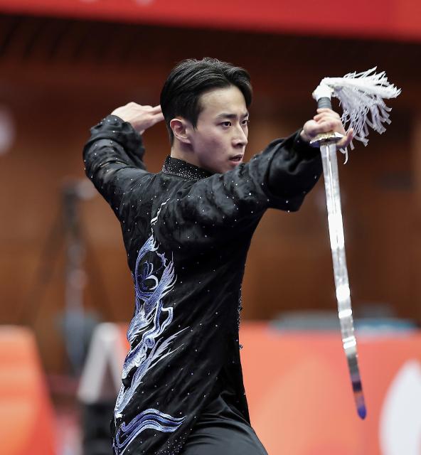 (260921) -- NAGOYA, Sept. 21, 2026 (Xinhua) -- An Hyeon-gi of South Korea performs during the Taijijian round of the men's Taijiquan and Taijijian final of Wushu at the 20th Asian Games Aichi-Nagoya 2026 in Nagoya of Aichi Prefecture, Japan, Sept. 21, 2026. (Xinhua/Long Lei)