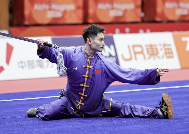 (260921) -- NAGOYA, Sept. 21, 2026 (Xinhua) -- Liu Dewen of China performs during the Taijijian round of the men's Taijiquan and Taijijian final of Wushu at the 20th Asian Games Aichi-Nagoya 2026 in Nagoya of Aichi Prefecture, Japan, Sept. 21, 2026. (Xinhua/Long Lei)
