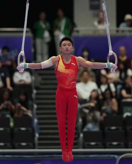 (260921) -- NAGOYA, Sept. 21, 2026 (Xinhua) -- Zou Jingyuan of China competes in the rings of Artistic Gymnastics at the 20th Asian Games Aichi-Nagoya 2026 in Nagoya, Japan, Sept. 21, 2026. (Xinhua/Jia Yuchen)