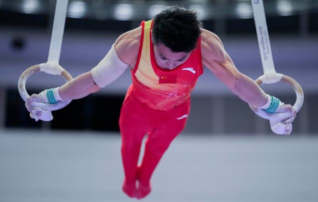 (260921) -- NAGOYA, Sept. 21, 2026 (Xinhua) -- Zou Jingyuan of China competes in the rings of Artistic Gymnastics at the 20th Asian Games Aichi-Nagoya 2026 in Nagoya, Japan, Sept. 21, 2026. (Xinhua/Lui Siu Wai)