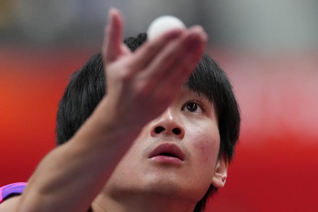 (260921) -- NAGOYA, Sept. 21, 2026 (Xinhua) -- Mak Tin Ian of Macao of China serves against Abdullah Abdulhussein of Qatar during the men's team Group A table tennis match between Macao of China and Qatar at the 20th Asian Games Aichi-Nagoya 2026 in Toyota, Japan, Sept. 21, 2026. (Xinhua/Cheong Kam Ka)