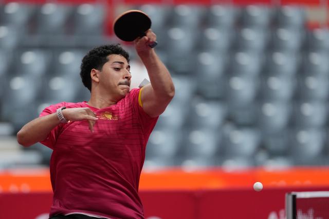 (260921) -- NAGOYA, Sept. 21, 2026 (Xinhua) -- Ahmed Korani of Qatar hits a return against Zheng Hong Wai of Macao of China during the men's team Group A table tennis match between Macao of China and Qatar at the 20th Asian Games Aichi-Nagoya 2026 in Toyota, Japan, Sept. 21, 2026. (Xinhua/Cheong Kam Ka)