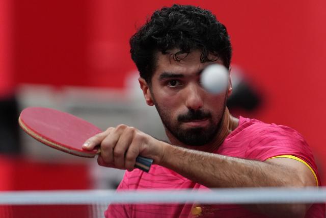 (260921) -- NAGOYA, Sept. 21, 2026 (Xinhua) -- Mohammed Ahussein of Qatar hits a return against Chan Chi In of Macao of China during the men's team Group A table tennis match between Macao of China and Qatar at the 20th Asian Games Aichi-Nagoya 2026 in Toyota, Japan, Sept. 21, 2026. (Xinhua/Cheong Kam Ka)