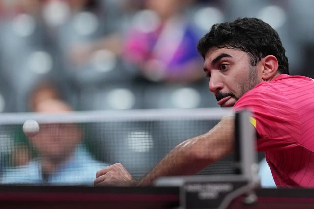 (260921) -- NAGOYA, Sept. 21, 2026 (Xinhua) -- Abdullah Abdulhussein of Qatar hits a return against Mak Tin Ian of Macao of China during the men's team Group A table tennis match between Macao of China and Qatar at the 20th Asian Games Aichi-Nagoya 2026 in Toyota, Japan, Sept. 21, 2026. (Xinhua/Cheong Kam Ka)