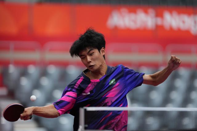 (260921) -- NAGOYA, Sept. 21, 2026 (Xinhua) -- Zheng Hong Wai of Macao of China hits a return against Ahmed Korani of Qatar during the men's team Group A table tennis match between Macao of China and Qatar at the 20th Asian Games Aichi-Nagoya 2026 in Toyota, Japan, Sept. 21, 2026. (Xinhua/Cheong Kam Ka)