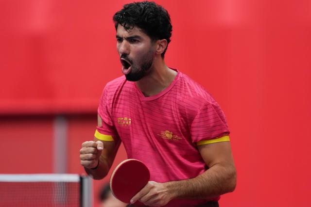 (260921) -- NAGOYA, Sept. 21, 2026 (Xinhua) -- Mohammed Ahussein of Qatar celebrates against Chan Chi In of Macao of China during the men's team Group A table tennis match between Macao of China and Qatar at the 20th Asian Games Aichi-Nagoya 2026 in Toyota, Japan, Sept. 21, 2026. (Xinhua/Cheong Kam Ka)