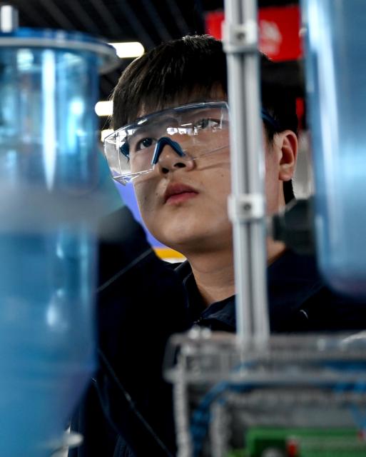 (260921) -- ZHENGZHOU, Sept. 21, 2026 (Xinhua) -- Lu Yi adjusts a device during a simulated competition training at a training base of Henan Chemical Technician College in Kaifeng City, central China's Henan Province, Sept. 1, 2026. At a training base of Henan Chemical Technician College, 23-year-old Lu Yi is preparing for the water technology event of the upcoming 48th WorldSkills Competition.
  Lu enrolled at Henan Chemical Technician College in 2019 and began training for the water technology event three years later. The water technology event focuses on evaluating competitors' abilities in wastewater treatment process operations, water quality analysis, mechanical equipment maintenance, and electrical automation. In 2025, Lu won the gold medal in the water technology event at China's third Vocational Skills Competition.
  During his daily training for the upcoming 48th WorldSkills Competition, Lu spends almost all his time in the laboratory, working with his coach to improve speed and adjust every detail of his movements. (Xinhua/Hao Yuan)