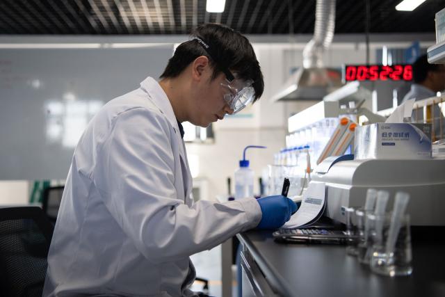 (260921) -- ZHENGZHOU, Sept. 21, 2026 (Xinhua) -- Lu Yi records and compares data at a training base of Henan Chemical Technician College in Kaifeng City, central China's Henan Province, Sept. 1, 2026. At a training base of Henan Chemical Technician College, 23-year-old Lu Yi is preparing for the water technology event of the upcoming 48th WorldSkills Competition.
  Lu enrolled at Henan Chemical Technician College in 2019 and began training for the water technology event three years later. The water technology event focuses on evaluating competitors' abilities in wastewater treatment process operations, water quality analysis, mechanical equipment maintenance, and electrical automation. In 2025, Lu won the gold medal in the water technology event at China's third Vocational Skills Competition.
  During his daily training for the upcoming 48th WorldSkills Competition, Lu spends almost all his time in the laboratory, working with his coach to improve speed and adjust every detail of his movements. (Photo by Kong Weijia/Xinhua)