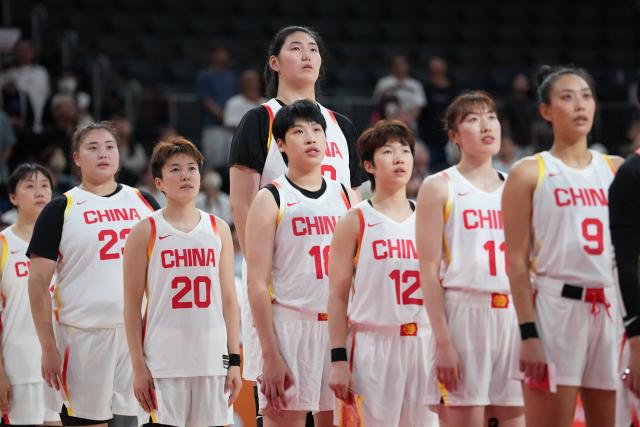 (260921) -- NAGOYA, Sept. 21, 2026 (Xinhua) -- Players of China sing the national anthem before the women's group A basketball match between China and Indonesia at the 20th Asian Games Aichi-Nagoya 2026 in Nagoya, Japan, Sept. 21, 2026. (Xinhua/Luo Yuan)