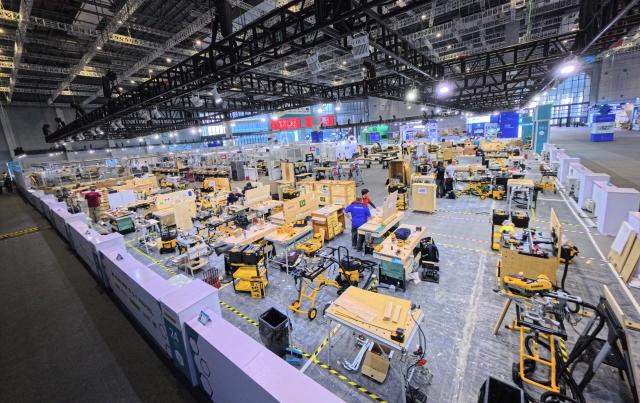 (260921) -- SHANGHAI, Sept. 21, 2026 (Xinhua) -- This photo taken on Sept. 21, 2026 shows the competition area for the Cabinetmaking skill during the 48th WorldSkills Competition at the National Exhibition and Convention Center (Shanghai) in east China's Shanghai. The 48th WorldSkills Competition is scheduled to take place from September 22 to 27 in Shanghai. (Xinhua/Fang Zhe)