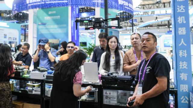 (260921) -- NANNING, Sept. 21, 2026 (Xinhua) -- A staff member operates a drone at the 23rd China-ASEAN Expo in Nanning, south China's Guangxi Zhuang Autonomous Region, Sept. 21, 2026. The 23rd China-ASEAN Expo features an exhibition area on future space, showcasing equipment such as drones and satellite navigation systems. (Xinhua/Zhang Ailin)