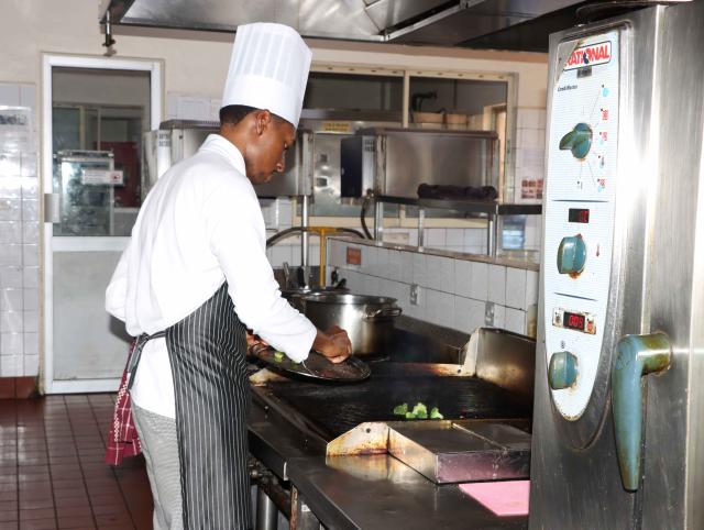 (260921) -- KAMPALA, Sept. 21, 2026 (Xinhua) -- Paul Lugobe, a Ugandan chef and one of the competitors of the 48th WorldSkills Competition in Shanghai, undergoes a culinary skills training at a hotel in Kampala, Uganda, Aug. 25, 2026. TO GO WITH "Feature: From Kampala to Shanghai, young Ugandan nurse takes first step onto WorldSkills stage" (WorldSkills Uganda/Handout via Xinhua)