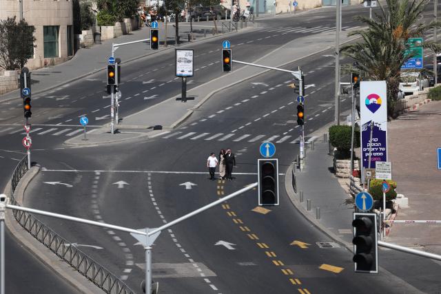(260921) -- JERUSALEM, Sept. 21, 2026 (Xinhua) -- People walk on a car-free road during the Jewish holiday of Yom Kippur in Jerusalem, on Sept. 21, 2026. (Photo by Jamal Awad/Xinhua)
