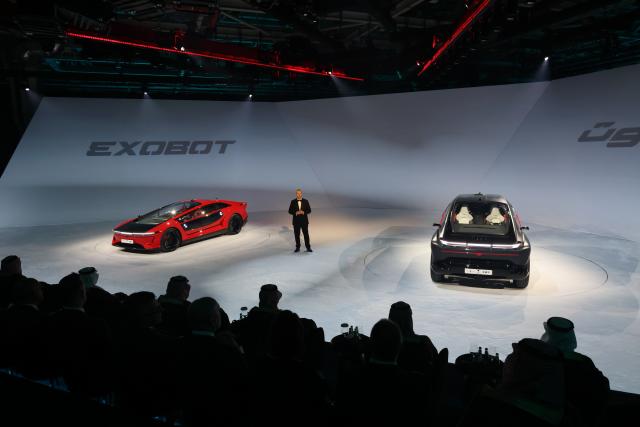 (260921) -- KING ABDULLAH ECONOMIC CITY, Sept. 21, 2026 (Xinhua) -- This photo taken on Sept. 21, 2026 shows the launch event for CEER's first electric vehicles in King Abdullah Economic City, Saudi Arabia. CEER, Saudi Arabia's first automotive brand, on Monday unveiled its first electric vehicles (EVs) under the name EXOBOT. (Xinhua/Luo Chen)