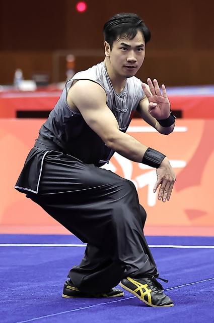 (260922) -- NAGOYA, Sept. 22, 2026 (Xinhua) -- Li Jianming of China competes during the Nanquan round of the men's Nanquan and Nangun final of Wushu at the 20th Asian Games Aichi-Nagoya 2026 in Nagoya of Aichi Prefecture, Japan, Sept. 22, 2026. (Xinhua/Long Lei)