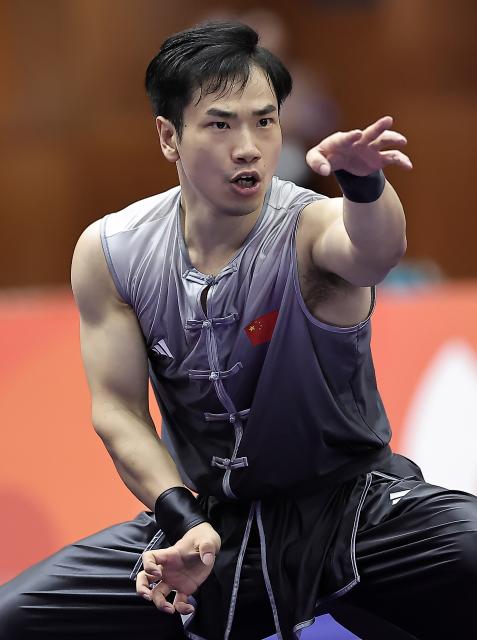 (260922) -- NAGOYA, Sept. 22, 2026 (Xinhua) -- Li Jianming of China competes during the Nanquan round of the men's Nanquan and Nangun final of Wushu at the 20th Asian Games Aichi-Nagoya 2026 in Nagoya of Aichi Prefecture, Japan, Sept. 22, 2026. (Xinhua/Long Lei)