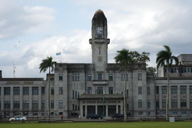 (260922) -- SUVA, Sept. 22, 2026 (Xinhua) -- This photo taken on Sept. 21, 2026 shows a view of Government Buildings in Suva, Fiji. Located on the southeastern coast of Fiji's main island, Suva is the country's capital, major port and the most populous city. It serves as a key regional hub of the South Pacific for transportation, governance and diplomacy, as well as a prominent center for culture and education. (Xinhua/Bai Yongquan)