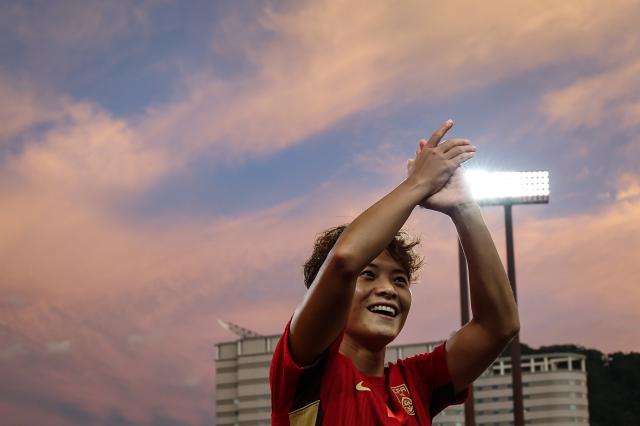 (260922) -- BEIJING, Sept. 22, 2026 (Xinhua) -- Wang Shuang of China greets spectators after the group G match of Women's Football between China and the Philippines at the 20th Asian Games Aichi-Nagoya 2026 in Gifu, Japan, Sept. 21, 2026. (Xinhua/Jia Haocheng)