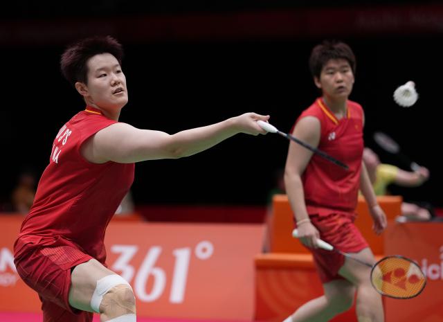 (260922) -- ICHINOMIYA, Sept. 22, 2026 (Xinhua) -- Liu Shengshu (L)/Tan Ning of team China compete against Hathaithip Mijad/Napapakorn Tungkasatan of team Thailand during the badminton women's team quarterfinals between China and Thailand at the 20th Asian Games Aichi-Nagoya 2026 in Ichinomiya, Japan, Sept. 22, 2026. (Xinhua/Li Bo)