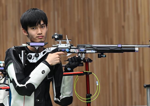 (260922) -- NAGOYA, Sept. 22, 2026 (Xinhua) -- Sheng Lihao of team China competes during the 10m air rifle mixed team final of shooting at the 20th Asian Games Aichi-Nagoya 2026 in Toyota of Aichi Prefecture, Japan, Sept. 22, 2026. (Xinhua/Liu Lei)