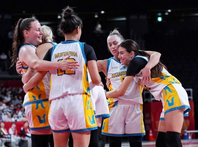 (260922) -- NAGOYA, Sept. 22, 2026 (Xinhua) -- Players of Kazakhstan celebrate winning the women's group B match between Hong Kong, China and Kazakhstan at 20th Asian Games Aichi-Nagoya 2026 in Nagoya, Japan, Sept. 22, 2026. (Xinhua/Luo Yuan)
