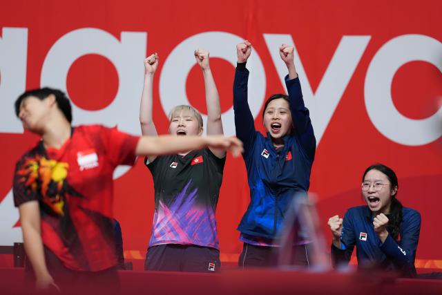 (260922) -- TOYOTA, Sept. 22, 2026 (Xinhua) -- Players of Hong Kong, China celebrate during the table tennis women's team first-round match between Hong Kong, China and Singapore at the 20th Asian Games Aichi-Nagoya 2026 in Toyota, Japan, Sept. 22, 2026. (Xinhua/Cheong Kam Ka)