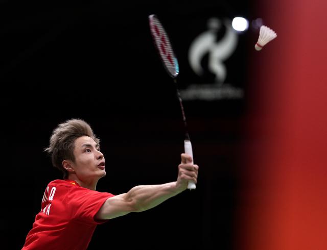 (260922) -- ICHINOMIYA, Sept. 22, 2026 (Xinhua) -- Shi Yuqi of team China hits a return during the singles match against Yoo Tae Bin of team South Korea during the badminton men's team quarterfinals between China and South Korea at the 20th Asian Games Aichi-Nagoya 2026 in Ichinomiya, Japan, Sept. 22, 2026. (Xinhua/Li Bo)