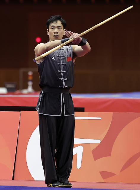 (260922) -- NAGOYA, Sept. 22, 2026 (Xinhua) -- Li Jianming of China competes during the Nangun round of the men's Nanquan and Nangun final of Wushu at the 20th Asian Games Aichi-Nagoya 2026 in Nagoya of Aichi Prefecture, Japan, Sept. 22, 2026. (Xinhua/Long Lei)