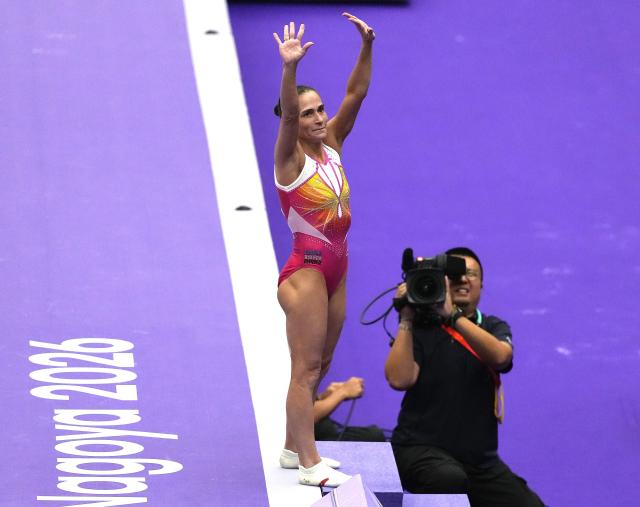 (260922) -- NAGOYA, Sept. 22, 2026 (Xinhua) -- Oksana Chusovitina of Uzbekistan greets spectators during the women's vault qualification of Artistic Gymnastics at the 20th Asian Games Aichi-Nagoya 2026 in Nagoya, Japan, Sept. 22, 2026. (Xinhua/Jia Yuchen)