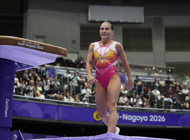 (260922) -- NAGOYA, Sept. 22, 2026 (Xinhua) -- Oksana Chusovitina of Uzbekistan smiles during the women's vault qualification of Artistic Gymnastics at the 20th Asian Games Aichi-Nagoya 2026 in Nagoya, Japan, Sept. 22, 2026. (Xinhua/Lui Siu Wai)