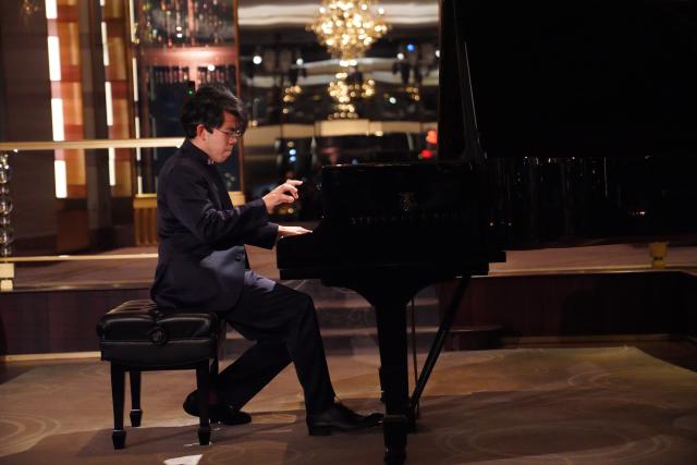 (260922) -- NEW YORK, Sept. 22, 2026 (Xinhua) -- Pianist Aristo Sham performs during a concert named Moonlit Melodies to celebrate the upcoming Mid-Autumn Festival at the Rainbow Room of Rockefeller Center in New York, the United States, on Sept. 21, 2026. The Mid-Autumn Festival in China, which is celebrated annually on the 15th day of the eighth month in the Chinese lunar calendar, falls on Sept. 25 this year. (Xinhua/Zhang Fengguo)