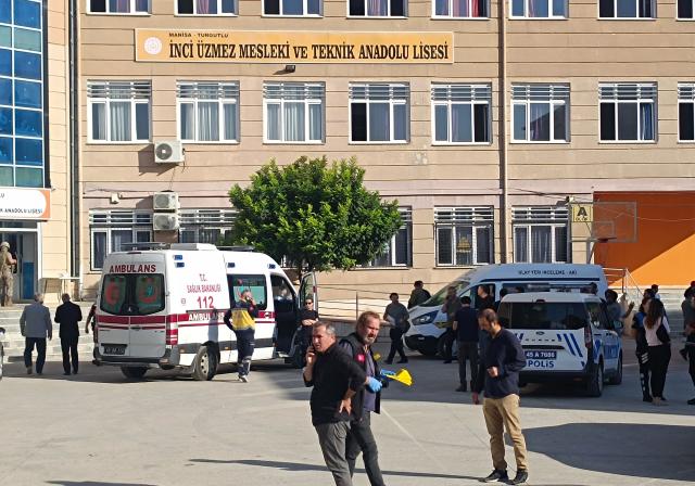 (260922) -- MANISA, Sept. 22, 2026 (Xinhua) -- An ambulance parks inside the high school where the shooting incident occurred nearby, in the Turgutlu district of Manisa, Türkiye, on Sept. 22, 2026. A teenage boy has been arrested and taken into custody after at least 11 people were injured in a shooting outside a high school in Türkiye's western province of Manisa on Tuesday morning, Justice Minister Akin Gurlek said. (Mustafa Kaya/Handout via Xinhua)