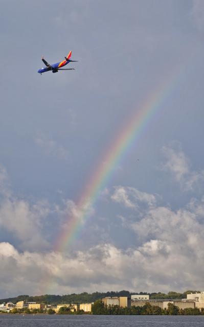(260922) -- WASHINGTON, Sept. 22, 2026 (Xinhua) -- This photo taken with a mobile phone shows a plane flying past a rainbow after rain in Washington, D.C., the United States, Sept. 21, 2026. (Xinhua/Wang Ye)
