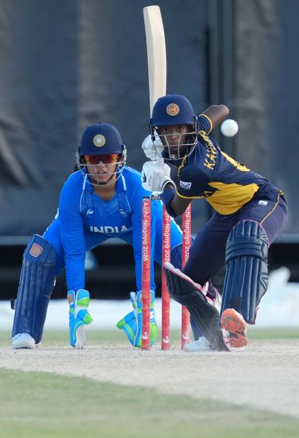 (260922) -- NISSHIN, Sept. 22, 2026 (Xinhua) -- Kaveesha Dilhari Walikonthagei (R) of Sri Lanka competes during the women's cricket gold medal match between India and Sri Lanka at the 20th Asian Games Aichi-Nagoya 2026 in Nisshin, Aichi Prefecture, Japan, Sept. 22, 2026. (Xinhua/Zhang Haobo)