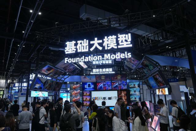 (260922) -- HANGZHOU, Sept. 22, 2026 (Xinhua) -- People visit the Foundation Models exhibition area during the 2026 Apsara Conference in Hangzhou, east China's Zhejiang Province, Sept. 22, 2026. The 2026 Apsara Conference opened here on Tuesday, and will last for three days. The conference has three main forums and more than 120 sub-forums. (Xinhua/Huang Zongzhi)