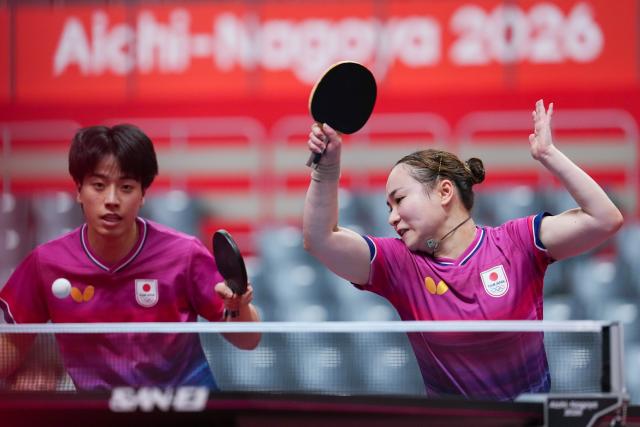 (260922) -- TOYOTA, Sept. 22, 2026 (Xinhua) -- Shinozuka Hiroto/Ito Mima (R) compete during the mixed doubles round 1 match between Shinozuka Hiroto/Ito Mima of Japan and Diyorbek Dilshodov/Asel Erkebaeva of Uzbekistan at the 20th Asian Games Aichi-Nagoya 2026 in Toyota, Japan, Sept. 22, 2026. (Xinhua/Cheong Kam Ka)