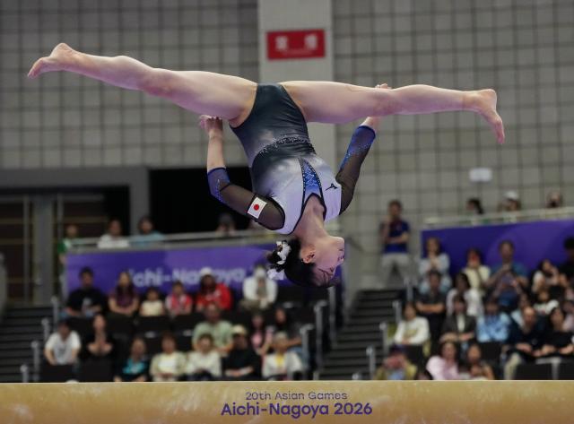 (260922) -- NAGOYA, Sept. 22, 2026 (Xinhua) -- Sugihara Aiko of Japan competes during the balance beam of the artistic gymnastics women's all-around final at the 20th Asian Games Aichi-Nagoya 2026 in Nagoya, Japan, Sept. 22, 2026. (Xinhua/Jia Yuchen)