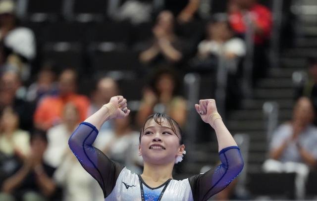 (260922) -- NAGOYA, Sept. 22, 2026 (Xinhua) -- Sugihara Aiko of Japan celebrates during the balance beam of the artistic gymnastics women's all-around final at the 20th Asian Games Aichi-Nagoya 2026 in Nagoya, Japan, Sept. 22, 2026. (Xinhua/Jia Yuchen)