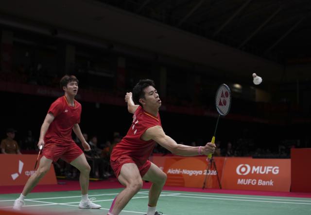(260922) -- ICHINOMIYA, Sept. 22, 2026 (Xinhua) -- Liu Yi (R)/He Jiting of team China compete during the doubles match against Kang Min Hyuk/Ki Dong Ju of team South Korea during the badminton men's team quarterfinals between China and South Korea at the 20th Asian Games Aichi-Nagoya 2026 in Ichinomiya, Japan, Sept. 22, 2026. (Xinhua/Li Bo)