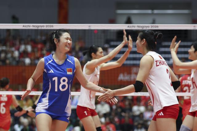 (260922) -- KOMAKI, Sept. 22, 2026 (Xinhua) -- Wang Mengjie (L) and Zhuang Yushan of China celebrate during the final match of Women's Volleyball between China and Japan at the 20th Asian Games Aichi-Nagoya 2026 in Komaki, Japan, Sept. 22, 2026. (Xinhua/Wang Fei)