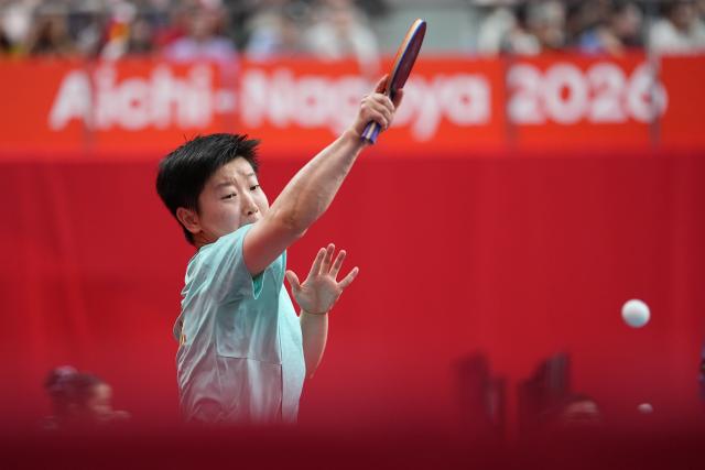 (260922) -- TOYOTA, Sept. 22, 2026 (Xinhua) -- Sun Yingsha of China hits a return to Asel Erkebaeva of Uzbekistan during the women's team quarterfinal match between China and Uzbekistan at the 20th Asian Games Aichi-Nagoya 2026 in Toyota, Japan, Sept. 22, 2026. (Xinhua/Cheong Kam Ka)