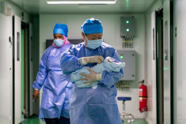 (260922) -- NOUAKCHOTT, Sept. 22, 2026 (Xinhua) -- A Chinese doctor from the Chinese naval hospital ship Auspicious Ark takes care of a newborn in Nouakchott, Mauritania, on Sept. 16, 2026. TO GO WITH "Roundup: Chinese hospital ship delivers care, deepens trust in Mauritania" (Xinhua/Xie Jianfei)