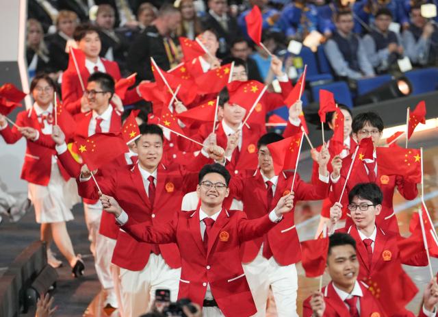 (260922) -- SHANGHAI, Sept. 22, 2026 (Xinhua) -- Members of Chinese delegation attend the opening ceremony of the 48th WorldSkills Competition in east China's Shanghai, Sept. 22, 2026. The 48th WorldSkills Competition opened in Shanghai on Tuesday evening, with 1,385 competitors from 68 countries and regions vying in 64 skill events. (Xinhua/Ren Pengfei)